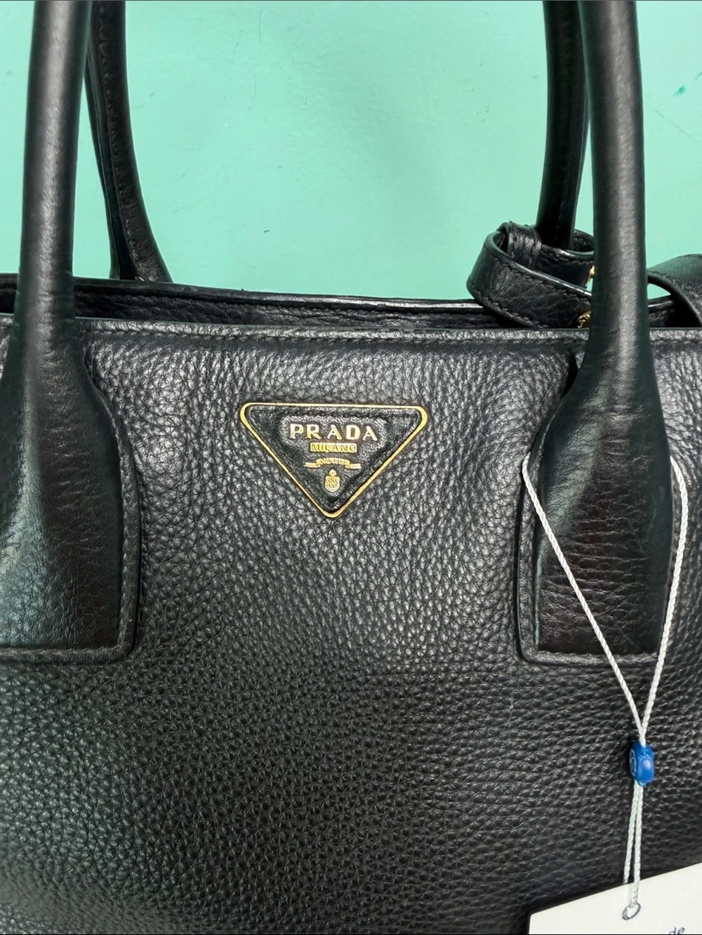 Authentic Prada Black  Leather Satchel with Gold Logo .